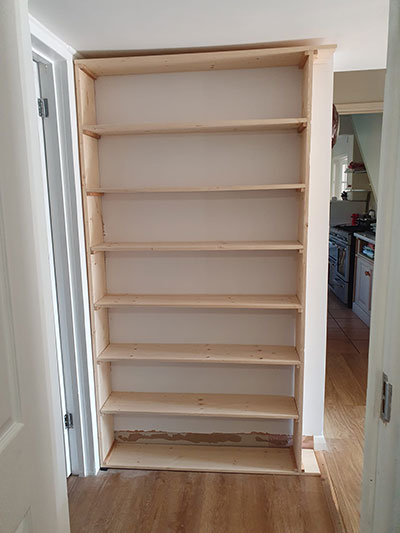 Bespoke wooden bookcase installation